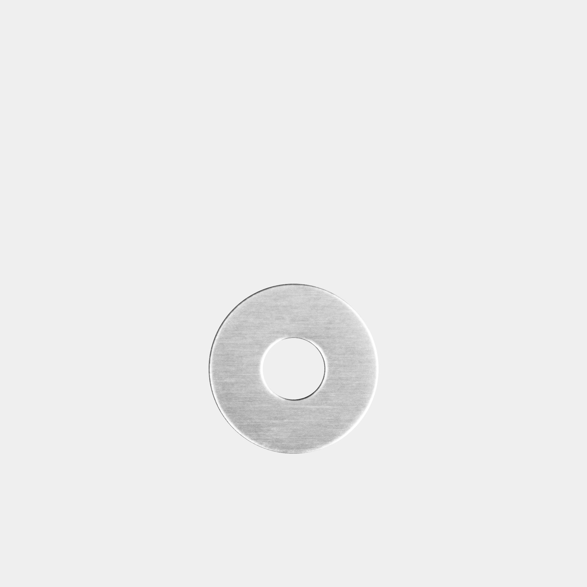The WAV Custom Extra Ring, a silver washer-shaped accessory with a central hole, rests elegantly against a light gray background.